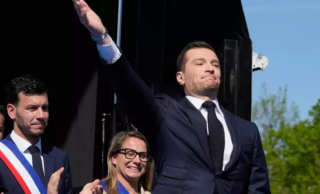 FILE - The leader of France's National Rally (RN) Jordan Bardella arrives as he attends at the French far-right party national rally near the parliament in support of Marine Le Pen in Paris, Sunday, April 6, 2025. (AP Photo/Michel Euler, File)