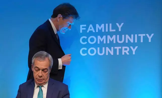 FILE - Reform UK leader Nigel Farage, front, and deputy leader Richard Tice attend a news conference on the economy and renewable energy, in London, Wednesday, Feb. 12, 2025. (AP Photo/Kin Cheung, File)