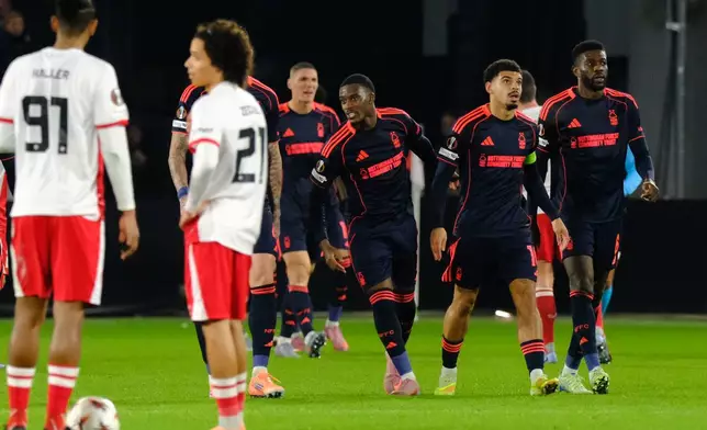 Nottingham Forest's Igor Jesus, second right, celebrates with teammates after scoring his side's second goal during the Europa League opening phase soccer match between Utrecht and Nottingham Forest, in Utrecht, Netherlands, Thursday, Dec. 11, 2025. (AP Photo/Patrick Post)