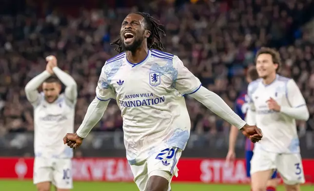 Villa's Eyann Guessand, front, celebrates after scoring the opening goal during the Europa League opening phase soccer match between FC Basel 1893 and Aston Villa in Basel, Switzerland, Thursday, Dec. 11, 2025. (Georgios Kefalas/Keystone via AP)