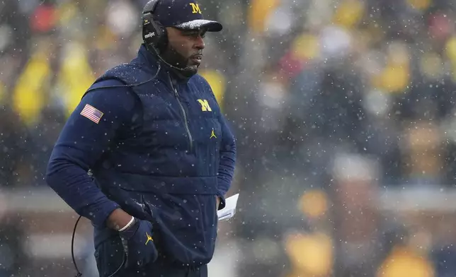 Michigan head coach Sherrone Moore watches from the sideline during the second half of an NCAA college football game against Ohio State, Saturday, Nov. 29, 2025, in Ann Arbor, Mich. (AP Photo/Ryan Sun)