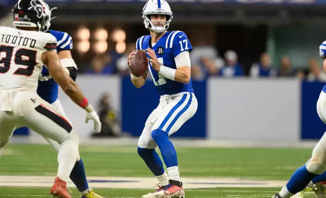 FILE - Indianapolis Colts quarterback Daniel Jones (17), wearing a special pad on his lower left leg, throws a pass during an NFL football game against the Houston Texans, Sunday, Nov. 30, 2025, in Indianapolis. (AP Photo/Zach Bolinger)