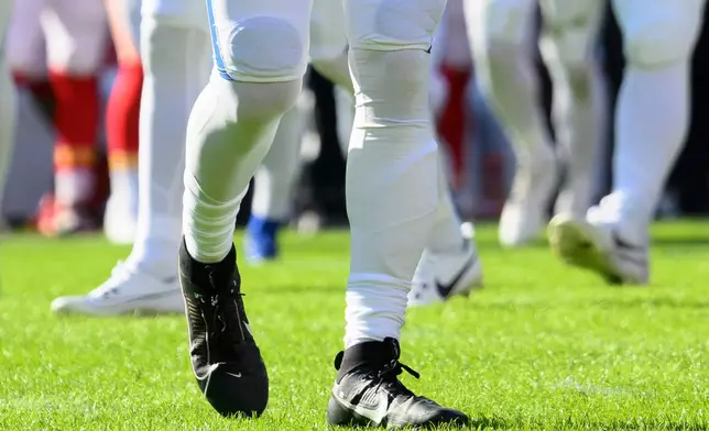FILE - Indianapolis Colts quarterback Daniel Jones, wearing a special pad on his lower left leg, looks to the sidelines during the first half of an NFL football game against the Kansas City Chiefs, Sunday, Nov. 23, 2025 in Kansas City, Mo. (AP Photo/Reed Hoffmann, File)