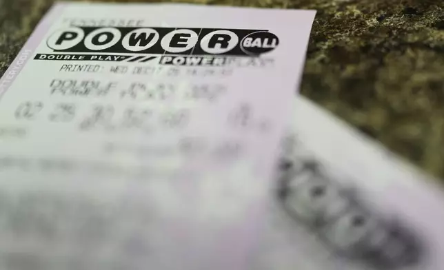 Powerball lottery tickets are seen Wednesday, Dec. 17, 2025, in Nashville, Tenn. (AP Photo/George Walker IV)