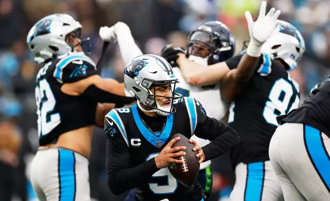 Carolina Panthers quarterback Bryce Young passes against the Seattle Seahawks during the second half of an NFL football game, Sunday, Dec. 28, 2025, in Charlotte, N.C. (AP Photo/Rusty Jones)