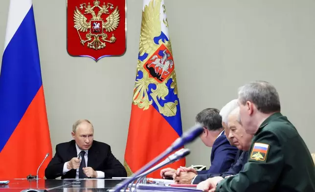 FILE - Russian President Vladimir Putin, left, leads a meeting with top security and defense officials at the Novo-Ogaryovo state residence outside of Moscow, Aug. 12, 2024. (Gavriil Grigorov, Sputnik, Kremlin Pool Photo via AP, File)