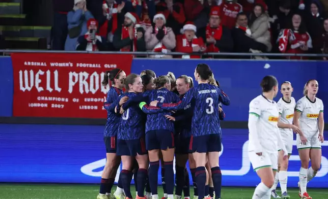 Arsenal players celebrate after Beth Mead scored their second goal during the women's Champions League opening phase soccer match between OH Leuven and Arsenal, in Leuven, Belgium, Wednesday, Dec. 17, 2025. (AP Photo/Omar Havana)