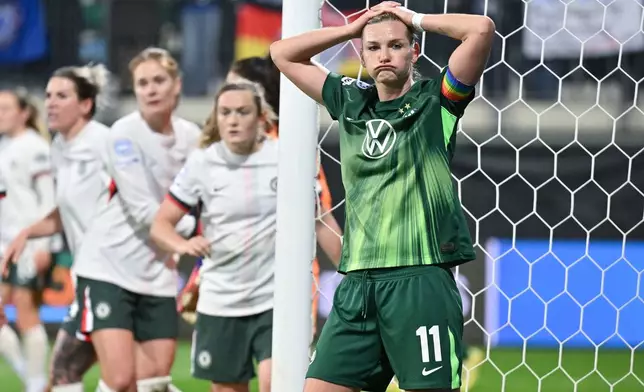 VfL Wolfsburg's Alexandra Popp reacts during the women's Champions League opening phase soccer match between VfL Wolfsburg and Chelsea in Wolfsburg, Germany, Wednesday, Dec. 17, 2025. (Swen Pförtner/dpa via AP)