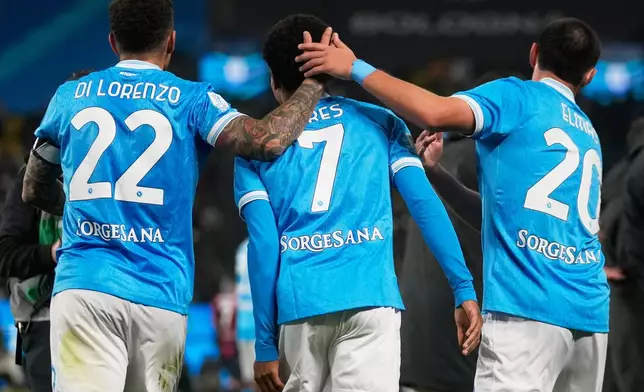 Napoli's David Neres, center, celebrates with teammates after scoring during the Italian Super Cup final soccer match between Napoli and Bologna in Riyadh, Saudi Arabia, Monday, Dec. 22, 2025. (AP Photo/Altaf Qadri