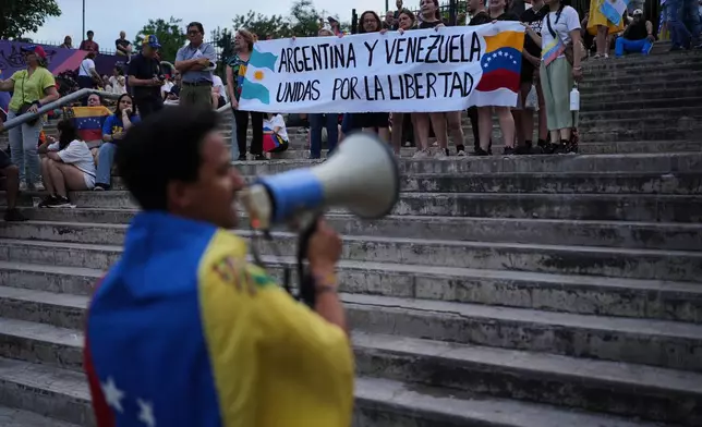 Members of Venezuelan's opposition demonstrate ahead of the Nobel Peace Prize ceremony where Venezuelan Maria Corina Machado is among this year's laureates, in Buenos Aires, Argentina, Saturday, Dec. 6, 2025. (AP Photo/Rodrigo Abd))