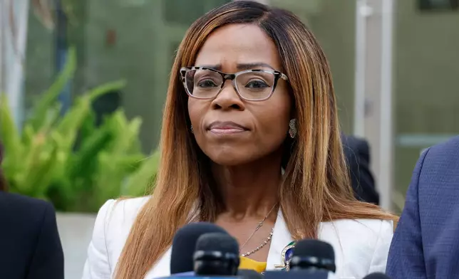 CORRECTS TO HEARING, NOT ARRAIGNMENT - U.S. Rep. Sheila Cherfilus-McCormick, D-Fla., speaks to the media after a hearing in federal court Monday, Dec. 29, 2025 in Miami. (AP Photo/Terry Renna)