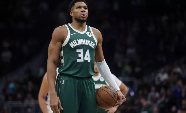 Milwaukee Bucks' Giannis Antetokounmpo prepares to shoot a free throw during the first half of an NBA basketball game against the Detroit Pistons Wednesday, Dec. 3, 2025, in Milwaukee. (AP Photo/Kylie Bridenhagen)