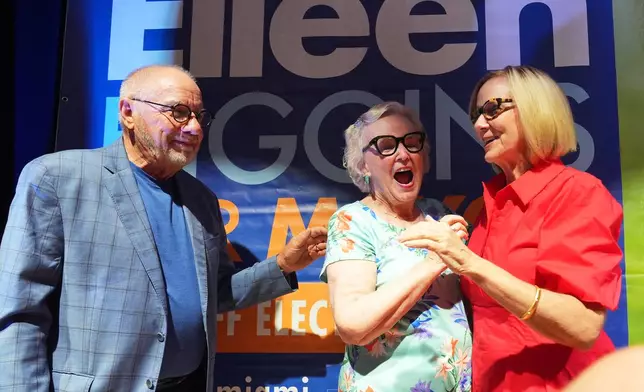 Miami mayor-elect Eileen Higgins, right, celebrates with her parents Cornelius and Patricia Higgins at a watch party after winning the Miami mayoral runoff election, Tuesday, Dec. 9, 2025, in Miami. (AP Photo/Lynne Sladky)