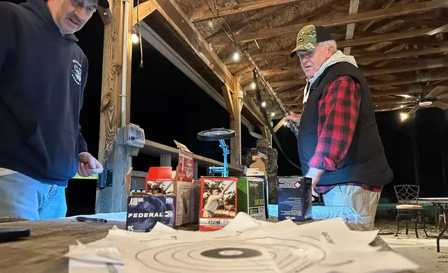 Glen Coplen, a past governor of Moose Lodge 1318, oversees the distribution of shotgun shells during a turkey shoot in Wake Forest, N.C., on Friday, Dec. 12, 2025. (AP Photo/Allen G. Breed)