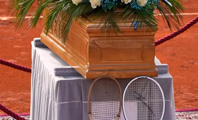 The coffin of Nicola Pietrangeli, Italian tennis champion of the 1950s and 1960s, is laid at the Pietrangeli tennis court at the Foro Italico ahead of the funeral service in Rome, Wednesday, Dec. 3, 2025. (AP Photo/Gregorio Borgia)
