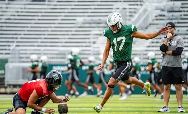Hawaii place kicker Kansei Matsuzawa, of Japan, kicks a field goal during an NCAA college football practice, Tuesday, Dec. 16, 2025, in Honolulu. (AP Photo/Mengshin Lin)