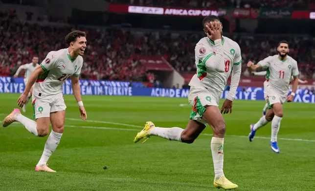 Morocco's Ayoub El Kaabi celebrates after scoring his side's first goal during the Africa Cup of Nations group A soccer match between Zambia and Morocco in Rabat, Morocco, Monday, Dec. 29, 2025. (AP Photo/Themba Hadebe)