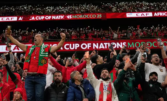 Morocco's fans celebrate during the Africa Cup of Nations group A soccer match between Zambia and Morocco in Rabat, Morocco, Monday, Dec. 29, 2025. (AP Photo/Themba Hadebe)