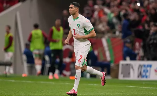 Morocco's Achraf Hakimi comes on during the second half of the Africa Cup of Nations group A soccer match between Zambia and Morocco in Rabat, Morocco, Monday, Dec. 29, 2025. (AP Photo/Themba Hadebe)