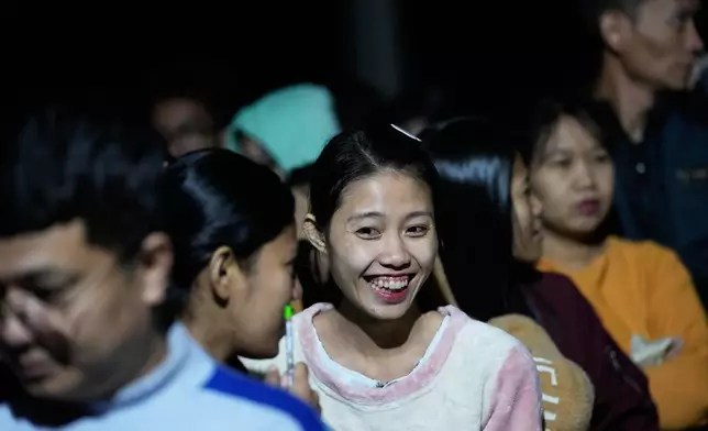 Voters wait for a polling station to open in Naypyitaw, Myanmar, Sunday, Dec. 28, 2025. (AP Photo/Aung Shine Oo)