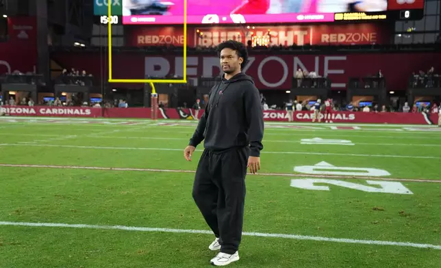 Injured Arizona Cardinals quarterback Kyler Murray walks off the field after an NFL football game against the Los Angeles Rams, Sunday, Dec. 7, 2025, in Glendale, Ariz. (AP Photo/Rick Scuteri)