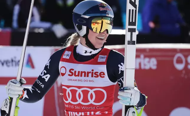 United States' Lindsey Vonn reacts in the finish area after completing an alpine ski, women's World Cup downhill, in St. Moritz, Switzerland, Saturday Dec. 13, 2025. (AP Photo/Luciano Bisi)