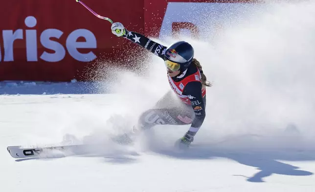 United States' Lindsey Vonn gets to the finish area after completing an alpine ski, women's World Cup downhill, in St. Moritz, Switzerland, Saturday Dec. 13, 2025. (AP Photo/Luciano Bisi)
