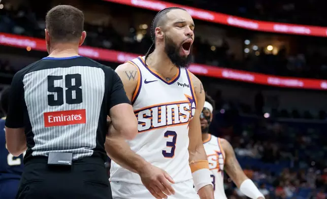 Phoenix Suns forward Dillon Brooks (3) reacts after a basket and a extra free throw-attempt following a foul by New Orleans Pelicans forward Trey Murphy III (not shown) during the second half of an NBA basketball game in New Orleans, Saturday, Dec. 27, 2025. (AP Photo/Matthew Hinton)