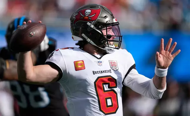 Tampa Bay Buccaneers quarterback Baker Mayfield passes against the Carolina Panthers during the first half of an NFL football game, Sunday, Dec. 21, 2025, in Charlotte, N.C. (AP Photo/Jacob Kupferman)
