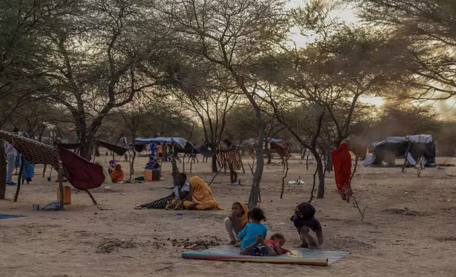 Malian refugees fleeing violence in Mali, sit in a makeshift camp where they found refuge in Douankara, Hodh El Chargui Region, Mauritania, Nov. 9 2025. (AP Photo/Caitlin Kelly)