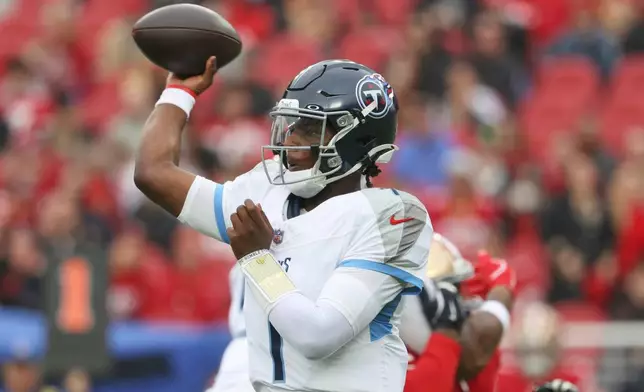 Tennessee Titans quarterback Cam Ward (1) looks to throw a pass during the first half of an NFL football game against the San Francisco 49ers, Sunday, Dec. 14, 2025, in Santa Clara, Calif. (AP Photo/Jed Jacobsohn)