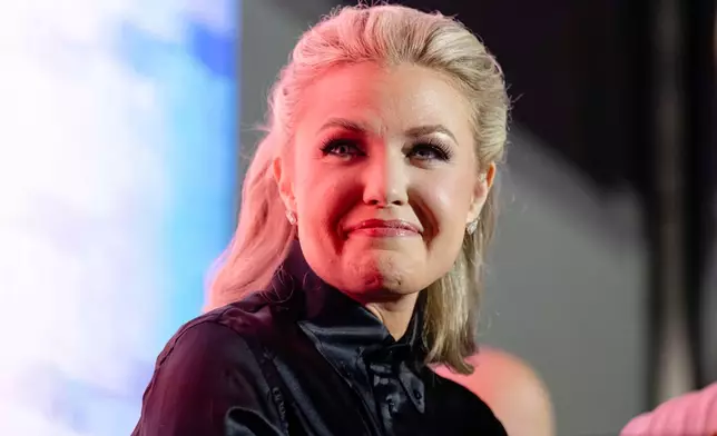 Erika Kirk smiles at a question and answer session during Turning Point USA's AmericaFest 2025, Friday, Dec. 19, 2025, in Phoenix. (AP Photo/Jon Cherry)