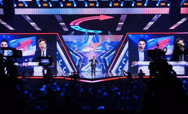 Benny Johnson speaks during Turning Point USA's AmericaFest 2025, Saturday, Dec. 20, 2025, in Phoenix. (AP Photo/Ross D. Franklin)