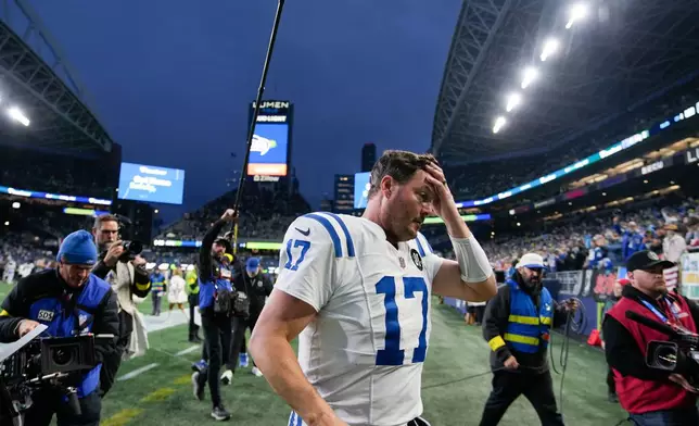 Indianapolis Colts quarterback Philip Rivers (17) leaves the field after an NFL football game against the Seattle Seahawks, Sunday, Dec. 14, 2025, in Seattle. (AP Photo/Stephen Brashear)