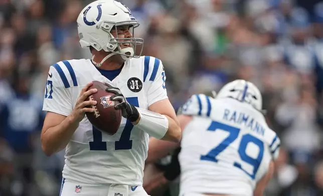 Indianapolis Colts quarterback Philip Rivers (17) looks to throw during the first half of an NFL football game against the Seattle Seahawks, Sunday, Dec. 14, 2025, in Seattle. (AP Photo/Lindsey Wasson)