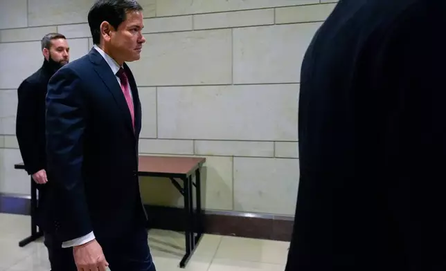 Secretary of State Marco Rubio arrives to brief members of Congress on military strikes near Venezuela, Tuesday, Dec. 16, 2025, at the Capitol in Washington. (AP Photo/Julia Demaree Nikhinson)