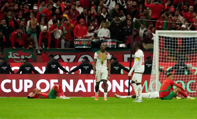 Players react following the African Cup of Nations Group A soccer match between Morocco and Mali in Rabat, Morocco, Friday, Dec. 26, 2025. (AP Photo/Mosa'ab Elshamy)