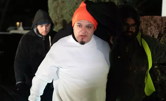 Kilmar Abrego García arrives to his home in Beltsville, Md., Thursday, Dec. 11, 2025, after being released from ICE custody. (AP Photo/Jose Luis Magana)