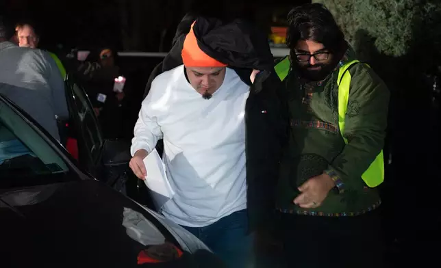 Kilmar Abrego García arrives to his home in Beltsville, Md., Thursday, Dec. 11, 2025, after being released from ICE custody. (AP Photo/Jose Luis Magana)
