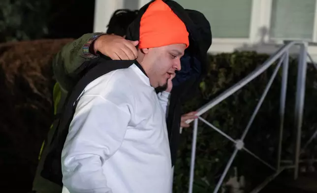 Kilmar Abrego García arrives to his home in Beltsville, Md., Thursday, Dec. 11, 2025, after being released from ICE custody. (AP Photo/Jose Luis Magana)