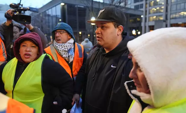 Kilmar Abrego Garcia waits to enter the building for a mandatory check at the Immigration and Customs Enforcement office in Baltimore, Friday, Dec. 12, 2025, after he was released from detention on Thursday under a judge's order. (AP Photo/Stephanie Scarbrough)