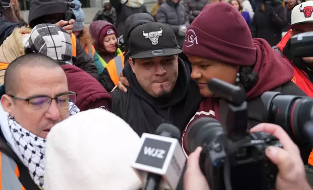 Kilmar Abrego Garcia leaves with Lydia Walther-Rodriguez of Casa in Maryland, after a mandatory check at the Immigration and Customs Enforcement office in Baltimore, Friday, Dec. 12, 2025, after he was released from detention on Thursday under a judge's order. (AP Photo/Stephanie Scarbrough)