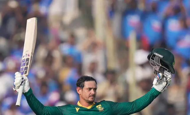 South Africa's Quinton de Kock celebrates his century during the third One Day International cricket match between India and South Africa in Visakhapatnam, India, Saturday, Dec. 6, 2025. (AP Photo/Mahesh Kumar A.)