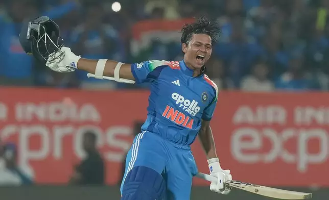 India's Yashasvi Jaiswal celebrates his century during the third One Day International cricket match between India and South Africa in Visakhapatnam, India, Saturday, Dec. 6, 2025. (AP Photo/Mahesh Kumar A.)