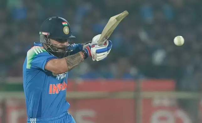 India's Virat Kohli plays a shot during the third One Day International cricket match between India and South Africa in Visakhapatnam, India, Saturday, Dec. 6, 2025. (AP Photo/Mahesh Kumar A.)