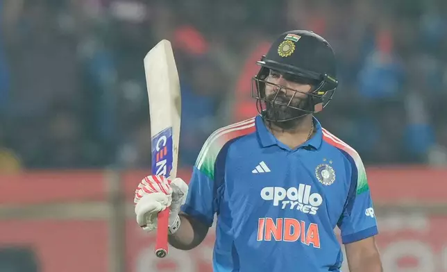 India's Rohit Sharma celebrates his fifty runs during the third One Day International cricket match between India and South Africa in Visakhapatnam, India, Saturday, Dec. 6, 2025. (AP Photo/Mahesh Kumar A.)