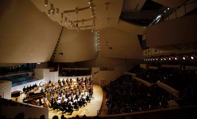 FILE - The New World Symphony performs under the direction of Michael Tilson Thomas, during the grand opening ceremony of the New World Center, a facility designed by architect Frank Gehry, Tuesday, Jan. 25, 2011, in Miami Beach, Fla. (AP Photo/Lynne Sladky, File)
