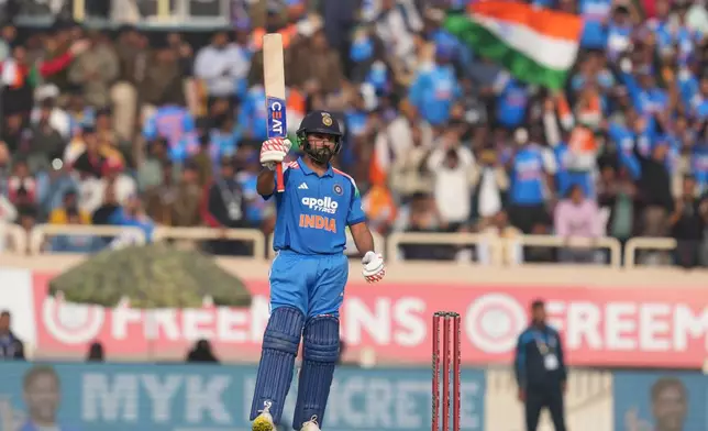 India's Rohit Sharma celebrates his fifty runs during the first One Day International match between India and South Africa in Ranchi, India, Sunday, Nov. 30, 2025. (AP Photo/Rafiq Maqbool)