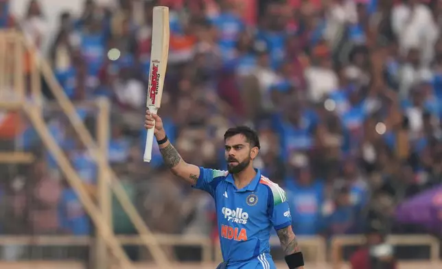 India's Virat Kohli celebrates his century during the first One Day International match between India and South Africa in Ranchi, India, Sunday, Nov. 30, 2025. (AP Photo/Rafiq Maqbool)