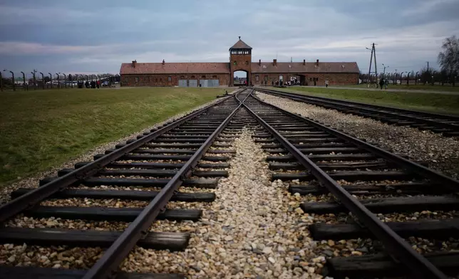 FILE - The railway tracks where hundred thousands of people arrived to be directed to the gas chambers inside the former Nazi death camp of Auschwitz Birkenau, or Auschwitz II, are pictured in Oswiecim, Poland, on Dec. 7, 2019. (AP Photo/Markus Schreiber, file)